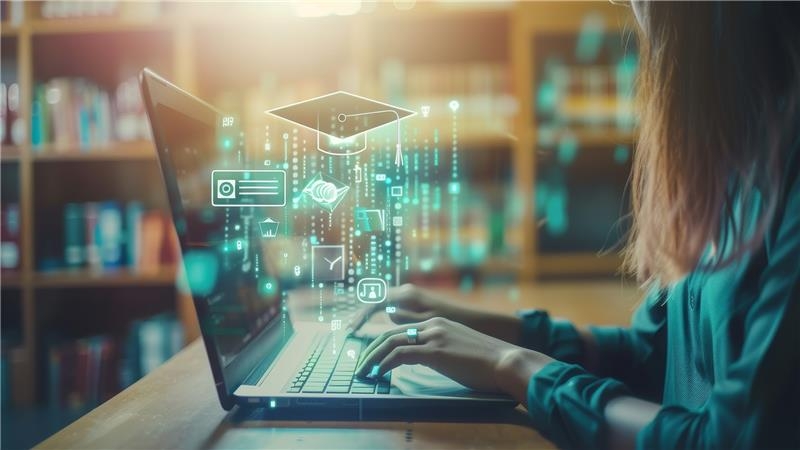 woman looking up IT certifications on a laptop for college