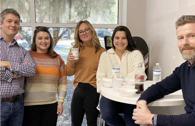 A C I team members enjoying a morning coffee