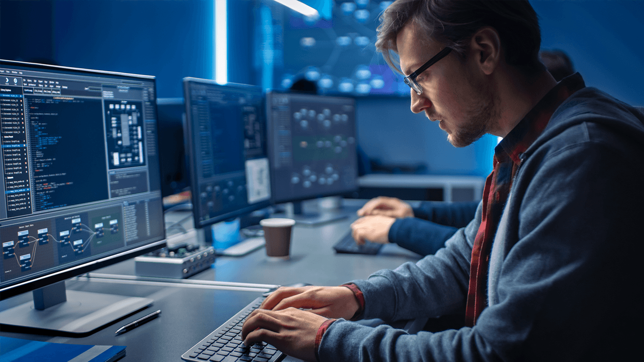 man at desk with computer