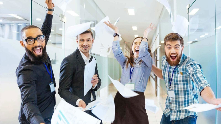 Group of people celebrating in an professional environment