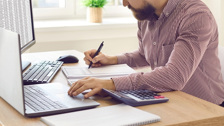 Auditor working from home on a laptop